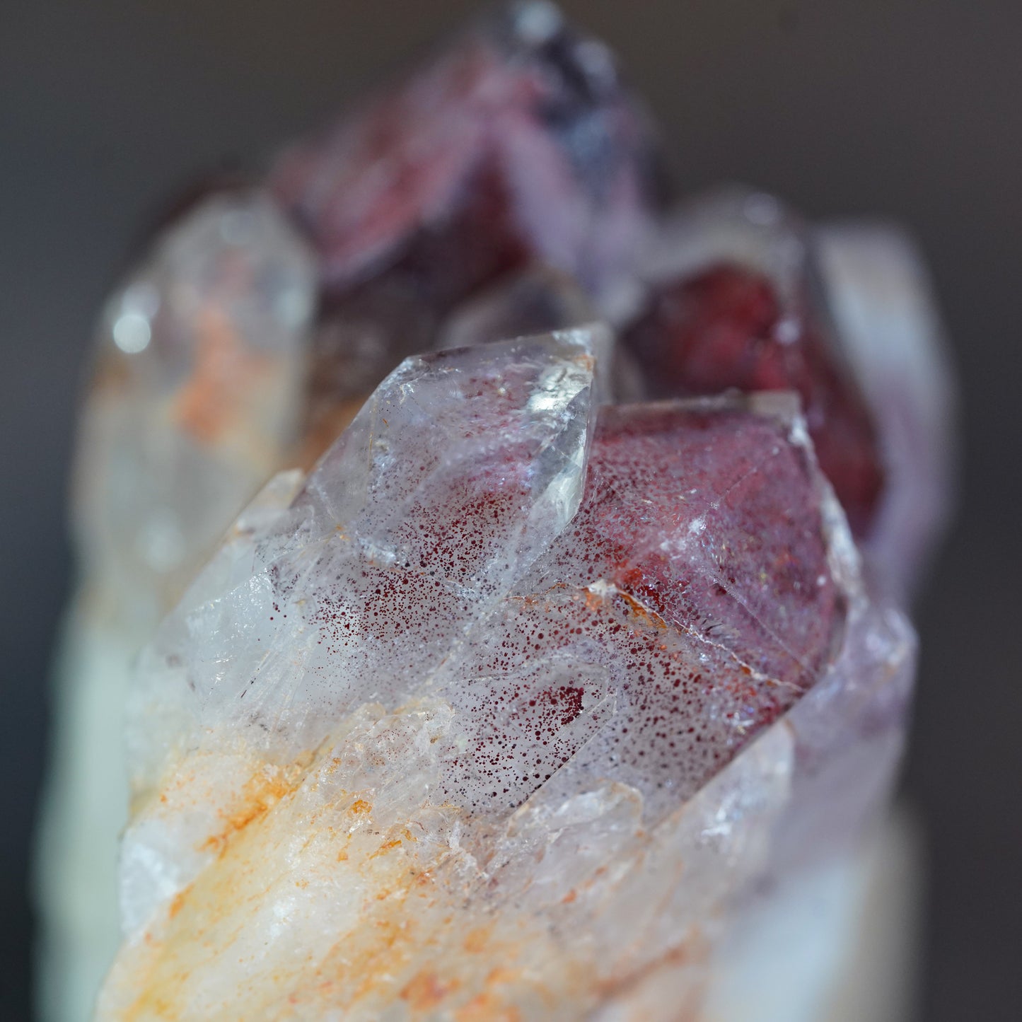 Close up of Red Hematite Inclusions and Phantoms in Quartz Cluster