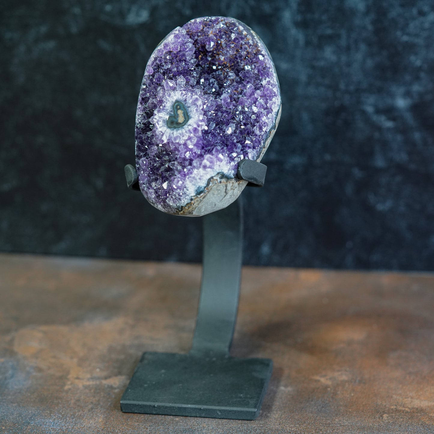 Purple Uruguayan Amethyst Geode displayed in custom stand