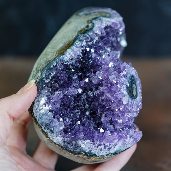 Side view of purple Uruguayan Amethyst crystal geode cluster