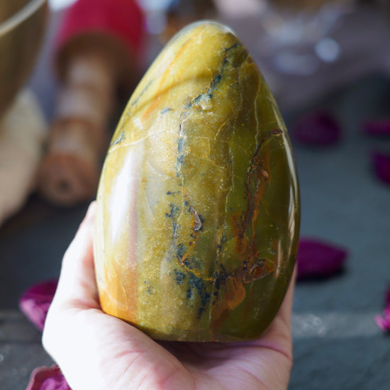 Large Green Opal Freeform Held In Hand